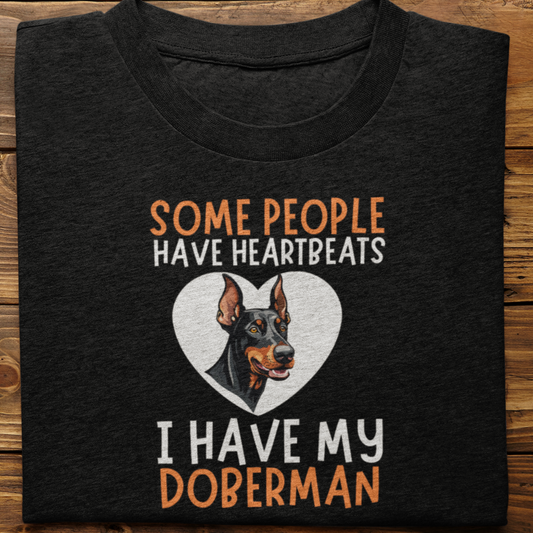 Doberman : Some Hearts Beat In Chests Tshirt Unisex